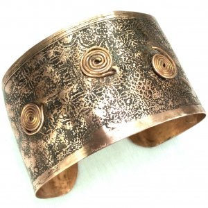 Copper etched bangle with pictish swirls